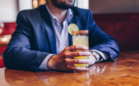 man holding a cocktail