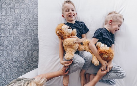 two kids and stuffed animals