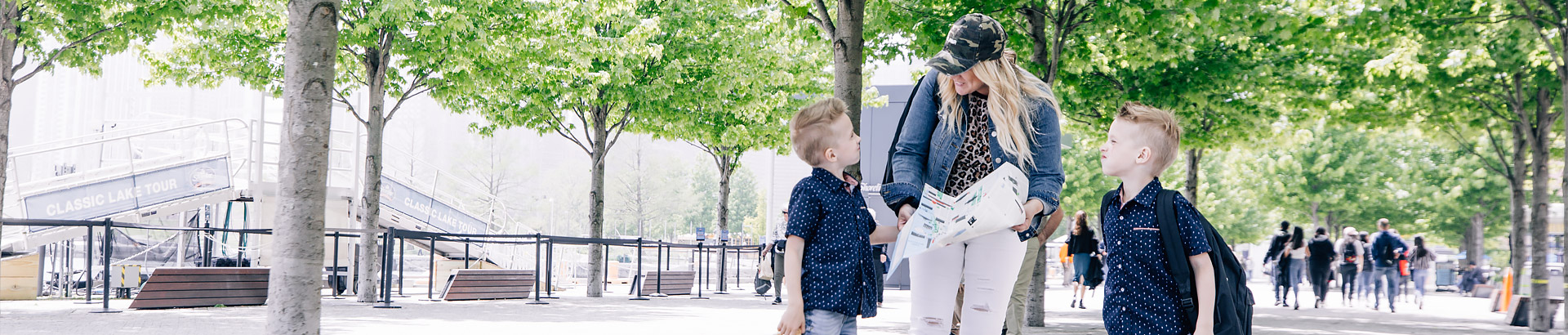 mom walking with her kids in the park