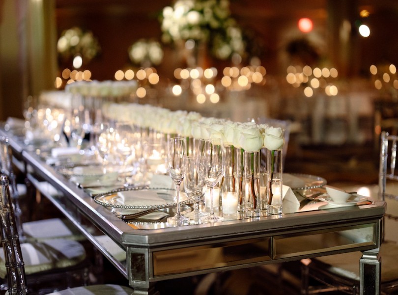 long table with chairs, plates and champagne glasses