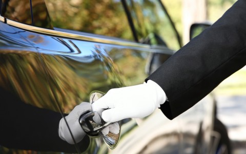 chauffeur opening car door