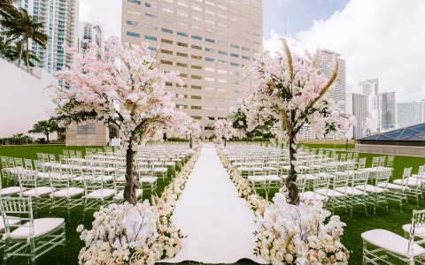 wedding aisle with flowers on a sunny day