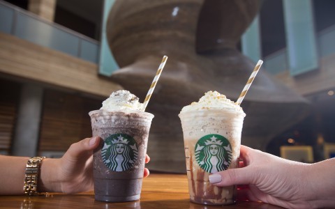 starbucks drinks on table with whip cream