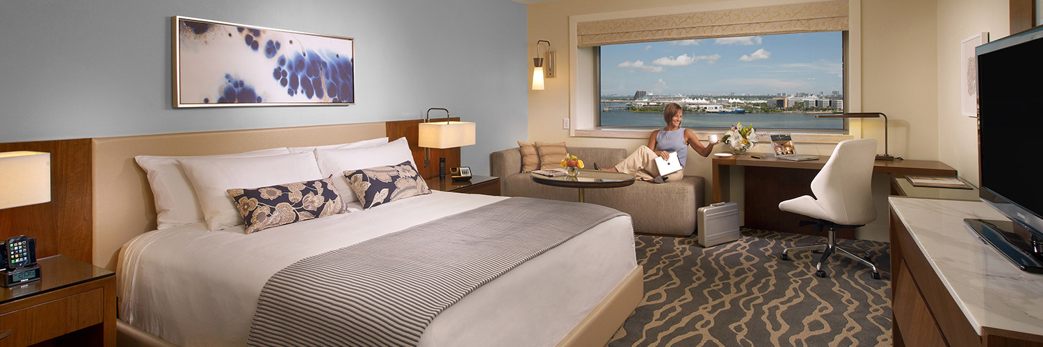 woman laying on couch in her hotel room