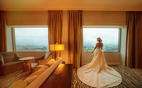 View of a beautiful bride at one of the hotel rooms