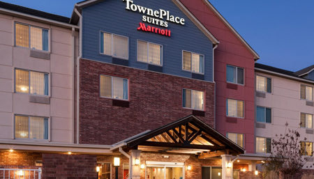 exterior of Townplace hotel with lights on at night