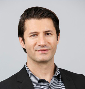 headshot of man with black blazer