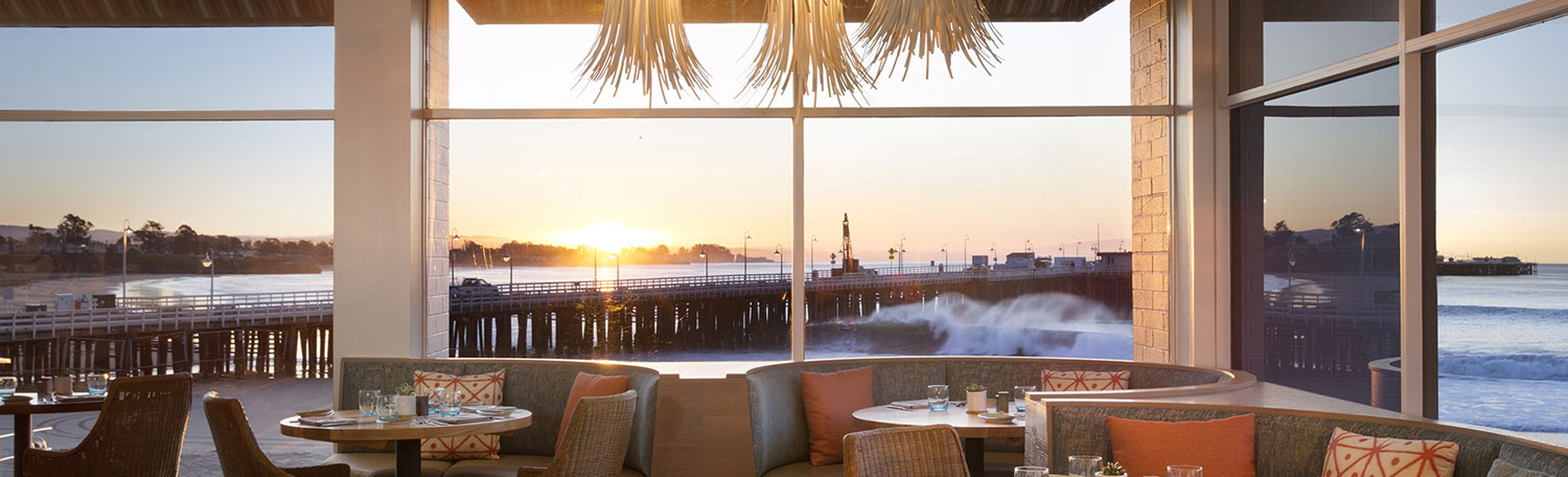 dining room with sunset ocean view