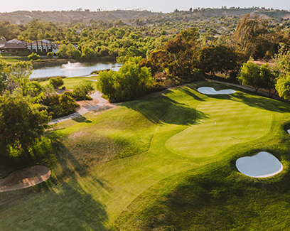 overhead view of a golf course during sunrise