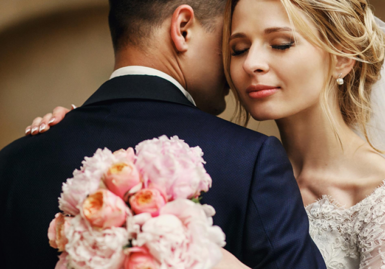 bride and groom hugging