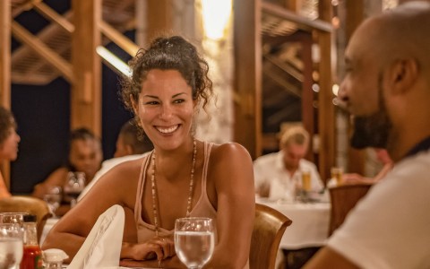 woman enjoying dinner in fancy restaurant 