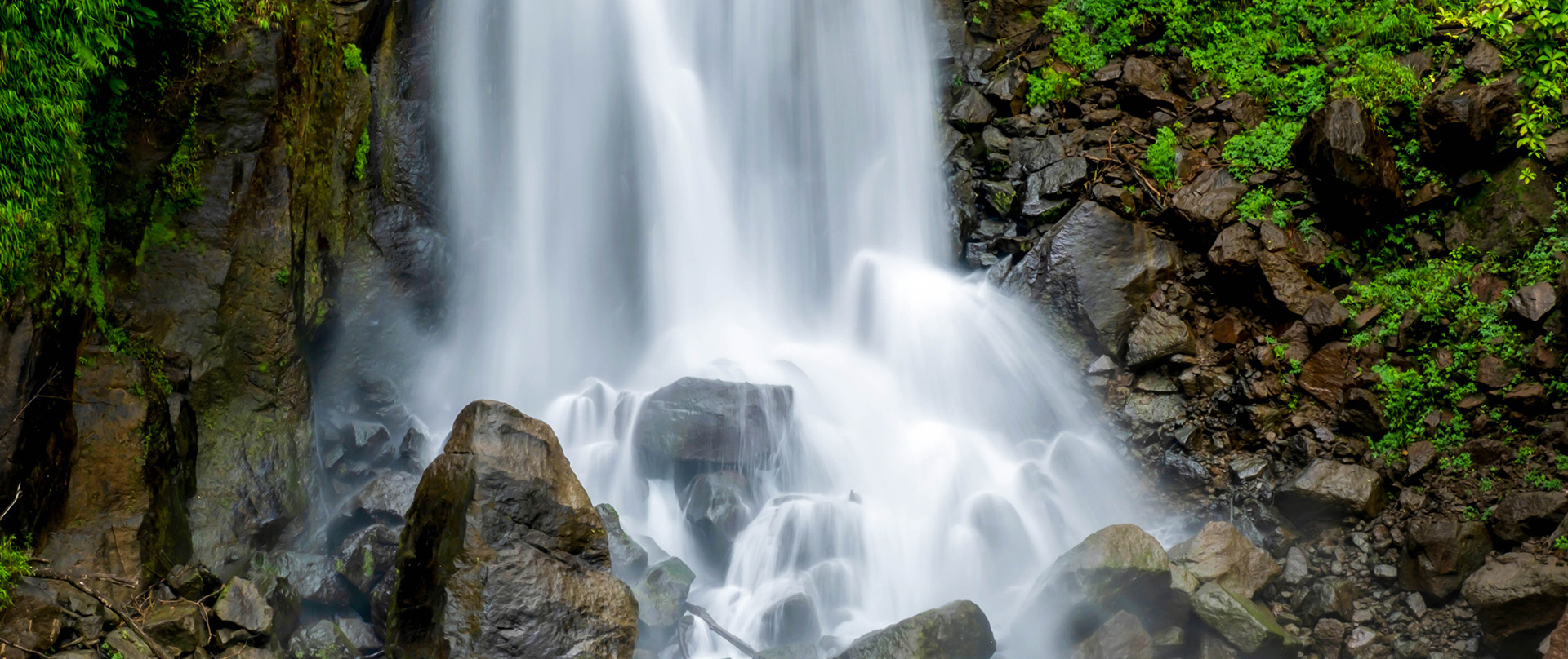 waterfall cascading on rocks