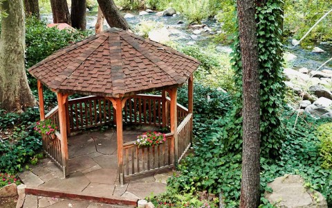 a small log cabin by the river side