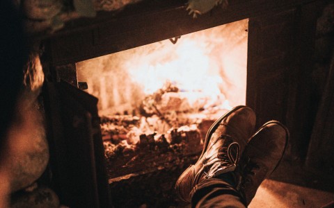 close view to a person by the fireplace 