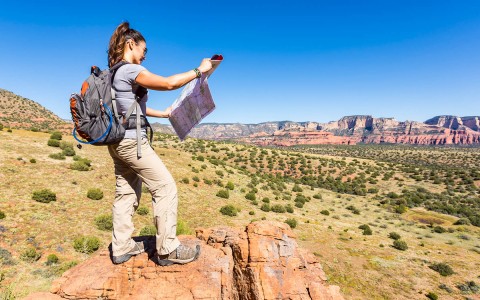 girl hiking with map