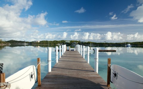 View of a wooden bridge next to a sea port