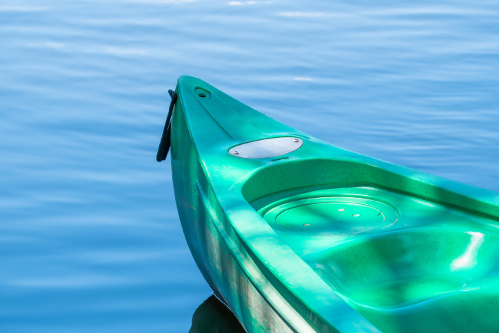 green kayak on ocean