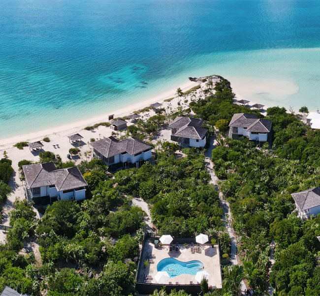 aerial view of kahari bungalows directly on the waterfront