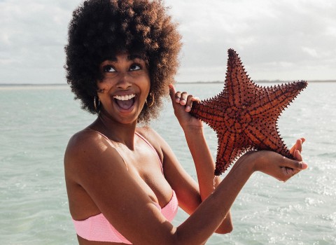 Lady holding a starfish