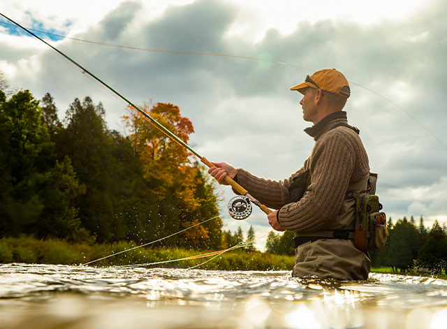 A man fishing at the lake