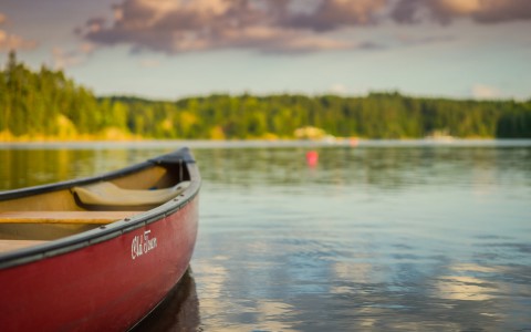 closeup view of a red canoe in the water 