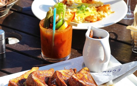 brunch meals featuring french toast, eggs, and a bloody mary