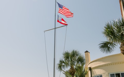 american flag pole outside hotel