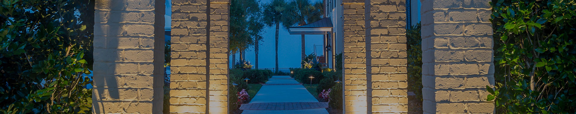 paved light walkway leading to the beach