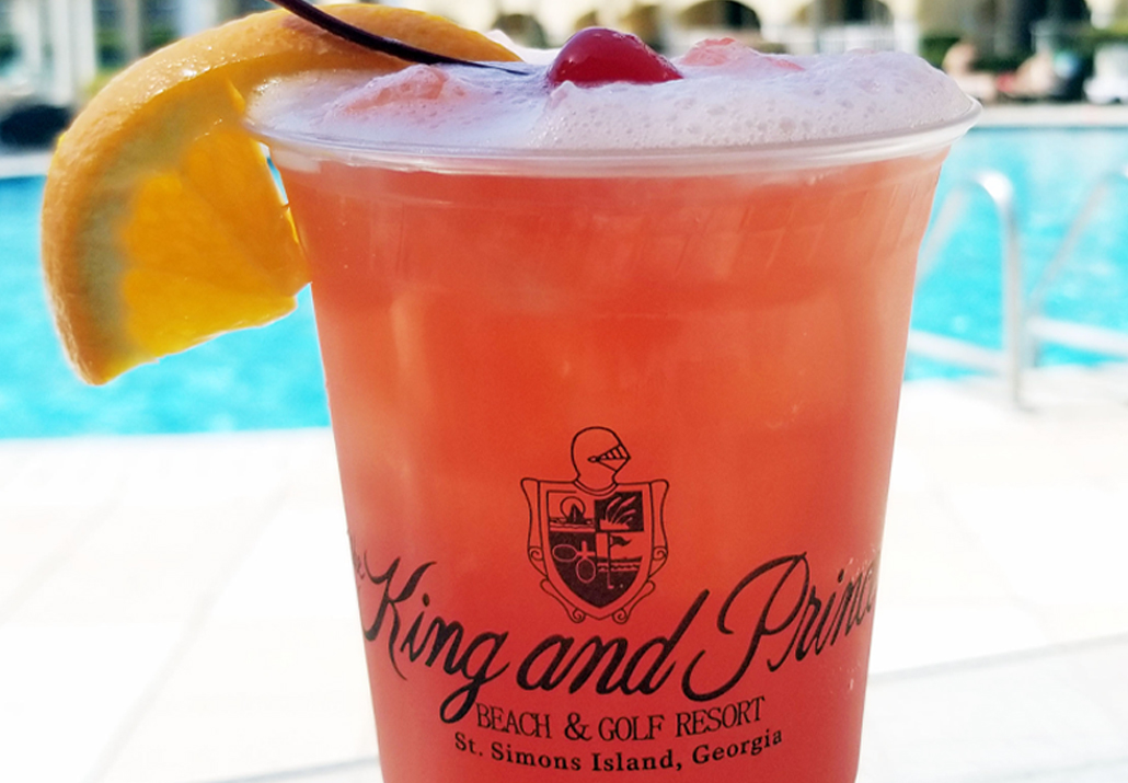 Tropical cocktail in a King and Price Logo Cup