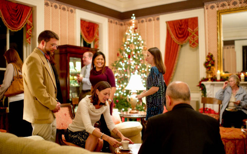 couples enjoying conversation in a room with christmas decor