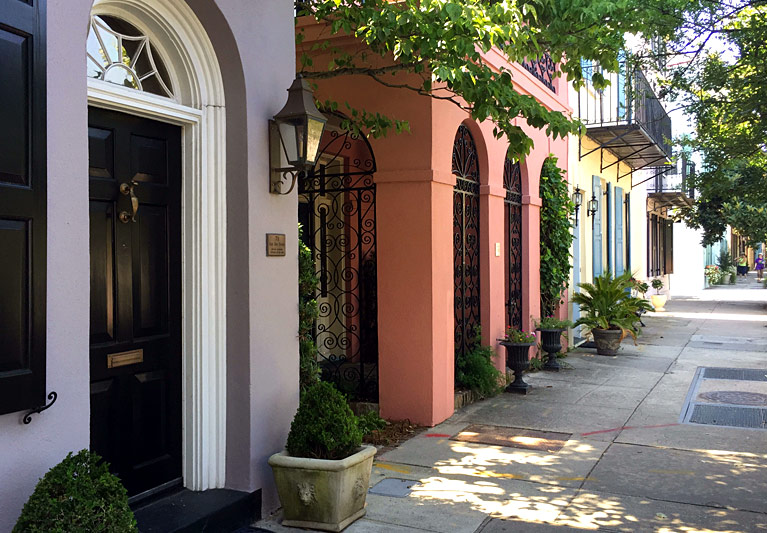 Peach colored entrance with black metallic gates