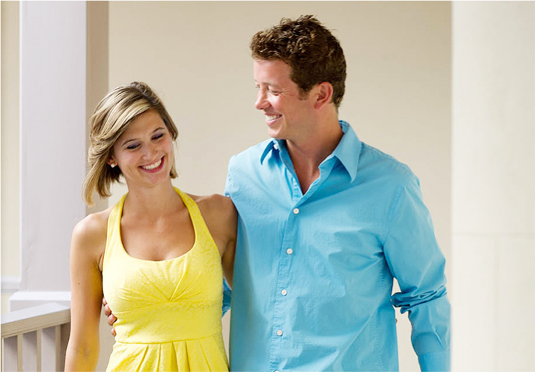 Woman in yellow dress next to man with light blue shirt