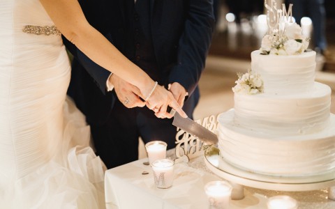 bride and groom cutting their marriage cake