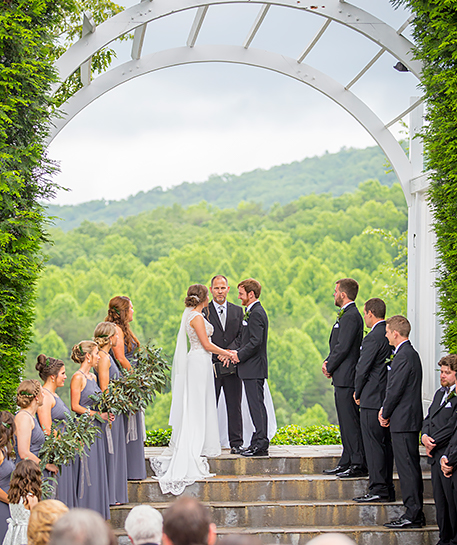 couple getting in the ceremony of they marriage in the nature 