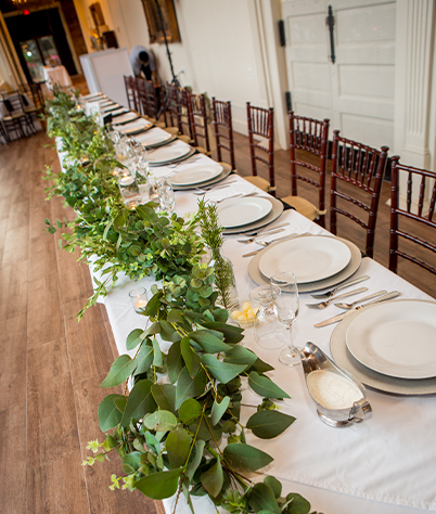 large table with all cutlery set up for a special occasion 