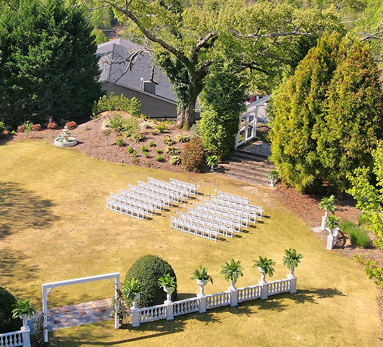 aerial view of place in the middle of the nature where people is gonna celebrate their marriage 