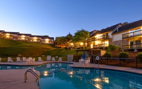 View of the property and the swimming pool area at night