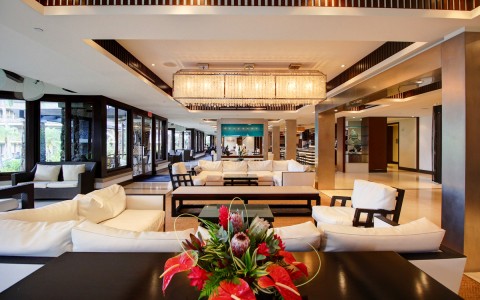 view of the elegant hotel lobby with several white couches