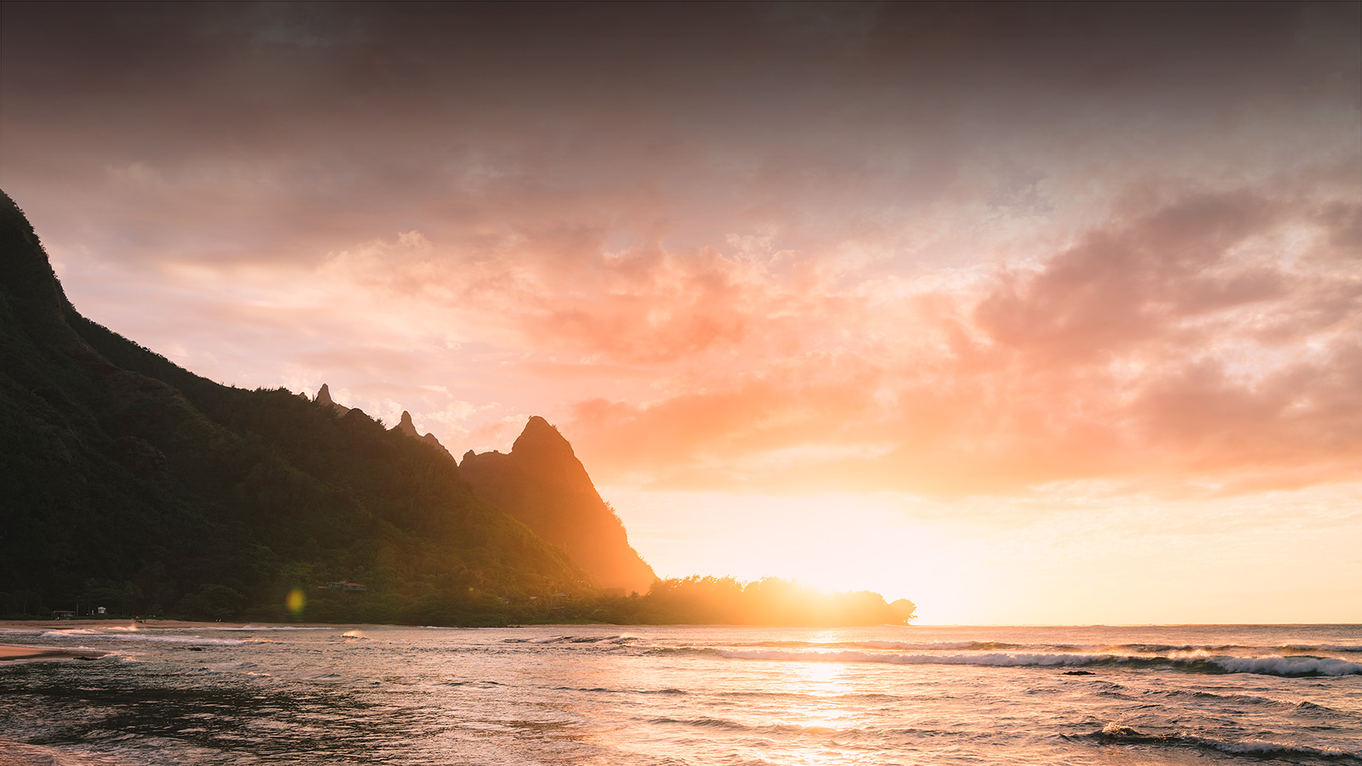view of the mountains and the ocean during sunset
