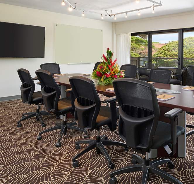 view of the koa meeting room with a large floral centerpiece at the table