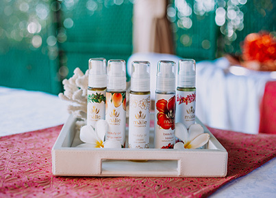white basket filled with spa items and white flowers