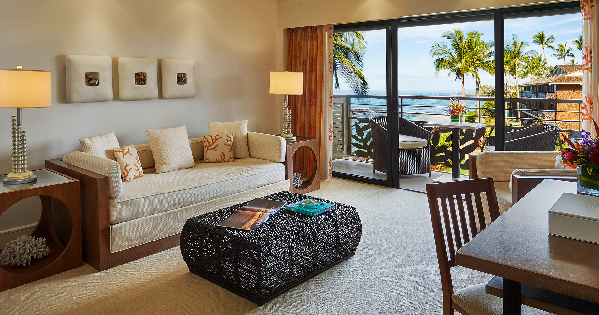 view of a spacious living room with a black coffee table and a cream colored couch