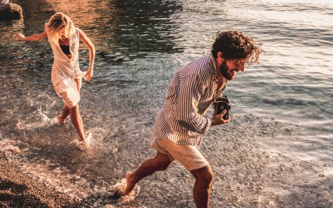 couple running on shoreline