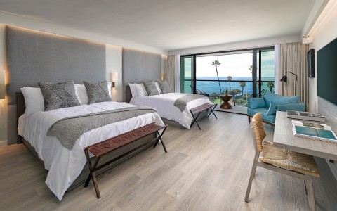 room with two queen beds and ocean view