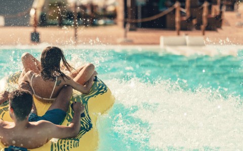 couple on water slide