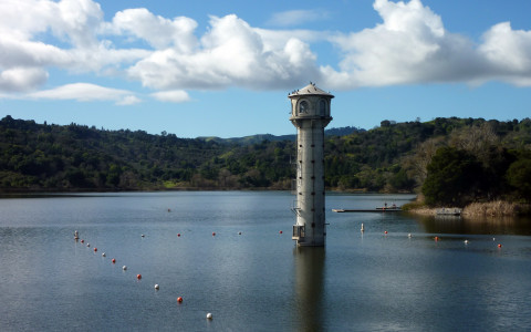 an image of a lighthouse on a lake