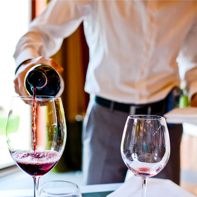 Man pouring wine into glass