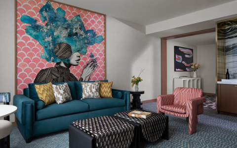 living area in one bedroom suite with orange and teal color scheme