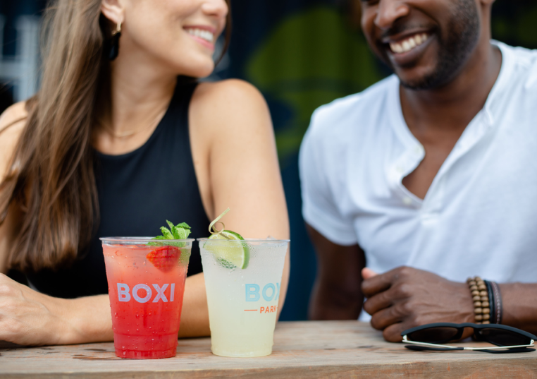a couple drinking boxi park cocktails