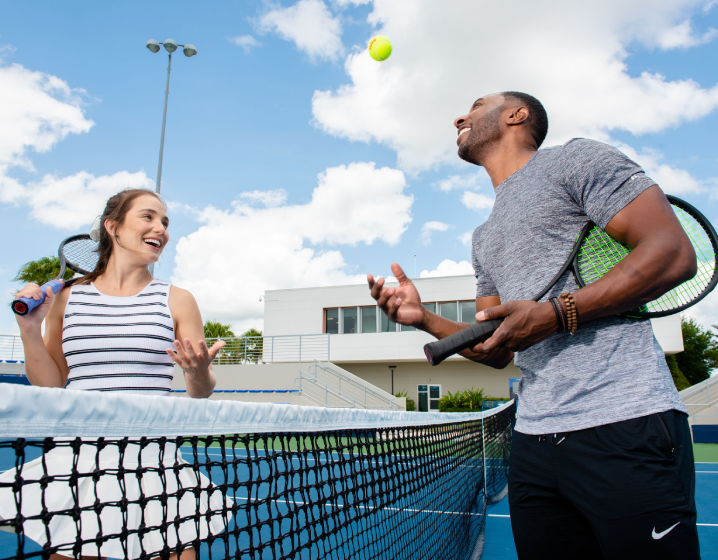 man and women playing tennis